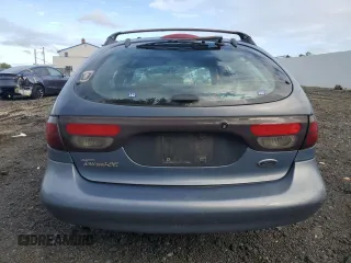 1999 Ford Taurus SE z VIN 1FAFP58S2XA261374, wystawiony jako Copart lot #74180494 z przebiegiem 193 416 mil mil oraz Szkody całkowita. Historia ofert i sprzedaży dostępna na DreamBid. Obrazek 6.