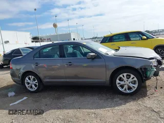 2012 Ford Fusion SE z VIN 3FAHP0HG0CR436745, wystawiony jako IAAI lot #41598812 z przebiegiem 116 305 mil mil oraz . Historia ofert i sprzedaży dostępna na DreamBid. Obrazek 14.