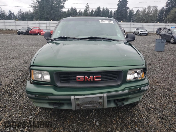 1997 GMC Jimmy SLS with VIN 1GKDT13WXV2563104, listed as a Copart auction lot 86317834 with 121,791 mi miles and Salvage Title. Bid and sale history available at carsss.com. Image 5.