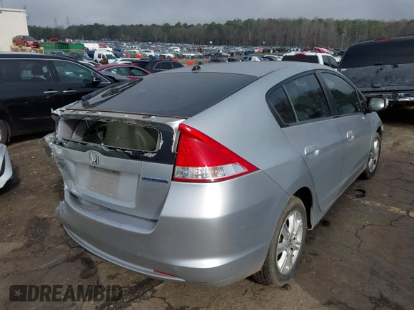 2010 Honda Insight EX with VIN JHMZE2H77AS022538, listed as a IAAI auction lot 41804579 with 184,000 mi miles and . Bid and sale history available at DreamBid. Image 3.