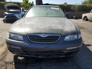 1997 Mazda Millenia z VIN JM1TA2213V1308406, wystawiony jako Copart lot #74141674 z przebiegiem 205 115 mil mil oraz Tytuł czysty. Historia ofert i sprzedaży dostępna na DreamBid. Obrazek 5.