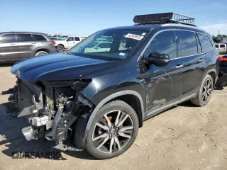 2019 Honda Pilot Touring 7-Passenger z VIN 5FNYF5H69KB019903, wystawiony jako Copart lot #43598805 z przebiegiem 144 486 mil mil oraz Szkoda całkowita • Salvage title. Historia ofert i sprzedaży dostępna na DreamBid. Obrazek 1.