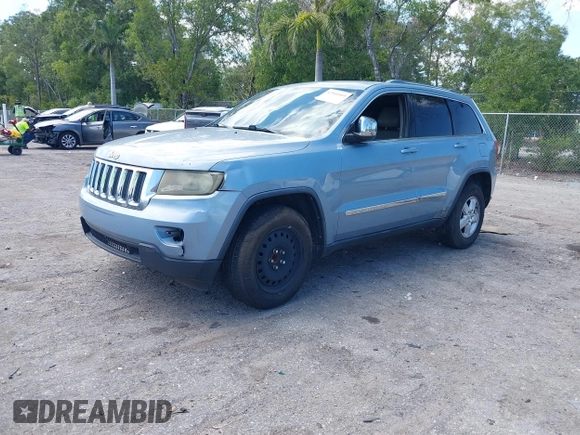 2013 Jeep Grand Cherokee Laredo with VIN 1C4RJEAG2DC517303, listed as a IAAI auction lot 42040405 with 222,952 mi miles. Bid and sale history available at carsss.com. Image 2.