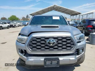 2021 Toyota Tacoma SR with VIN 3TMCZ5AN6MM393306, listed as a IAAI auction lot 42094095 with 57,217 mi miles and . Bid and sale history available at DreamBid. Image 12.