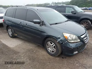 2005 Honda Odyssey EX-L with VIN 5FNRL38795B068209, listed as a IAAI auction lot 42504951 with 245,641 mi miles and . Bid and sale history available at DreamBid. Image 1.