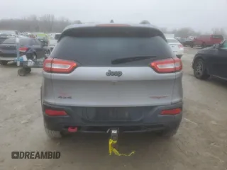 2014 Jeep Cherokee Trailhawk with VIN 1C4PJMBS1EW240177, listed as a Copart auction lot 43321715 with 212,339 mi miles and Salvage title. Bid and sale history available at DreamBid. Image 6.