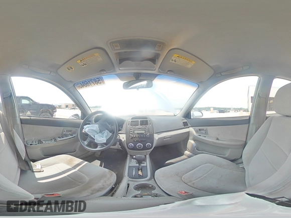 2007 Kia Spectra EX with VIN KNAFE121275411319, listed as a Copart auction lot 58716045 with 309,488 mi miles and Salvage title. Bid and sale history available at DreamBid. Image 14.