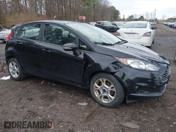 2015 Ford Fiesta SE with VIN 3FADP4EJ9FM175123, listed as a IAAI auction lot 41948452 with 130,801 mi miles. Bid and sale history available at carsss.com. Image 1.