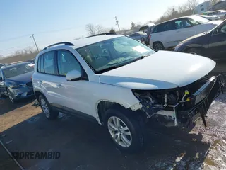 2016 Volkswagen Tiguan SE with VIN WVGBV7AX0GW018760, listed as a IAAI auction lot 41733586 with 60,743 mi miles and . Bid and sale history available at DreamBid. Image 14.