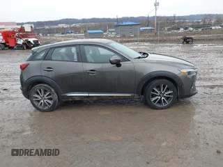 2016 Mazda CX-3 Grand Touring with VIN JM1DKBD77G0107328, listed as a IAAI auction lot 41682949 with 156,935 mi miles. Bid and sale history available at carsss.com. Image 13.