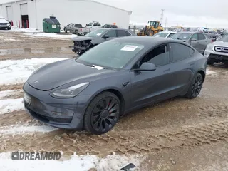2023 Tesla Model 3 Performance with VIN 5YJ3E1EC6PF590739, listed as a IAAI auction lot 40919165 with 20,474 mi miles. Bid and sale history available at carsss.com. Image 2.