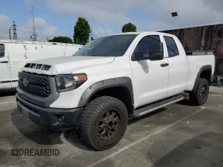 2018 Toyota Tundra SR with VIN 5TFRM5F15JX127909, listed as a Copart auction lot 56242865 with 142,887 mi miles and Salvage title. Bid and sale history available at DreamBid. Image 1.