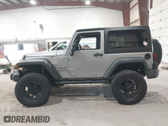 2014 Jeep Wrangler Sport with VIN 1C4AJWAG0EL173362, listed as a IAAI auction lot 42231863 with 99,321 mi miles and . Bid and sale history available at DreamBid. Image 14.