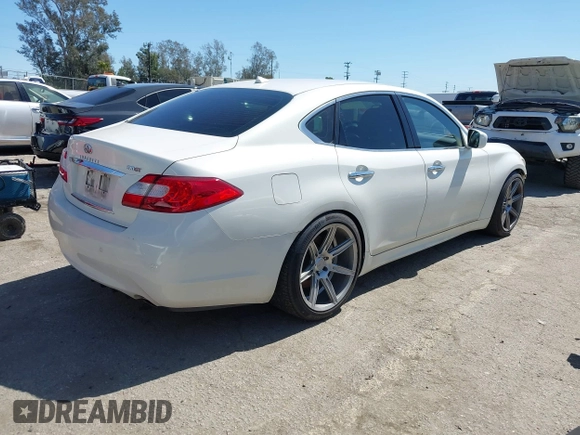 2013 Infiniti M with VIN JN1BY1AP6DM511104, listed as a IAAI auction lot 41818184 with 138,605 mi miles and . Bid and sale history available at DreamBid. Image 4.