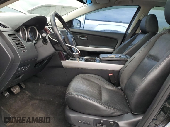 2015 Mazda CX-9 Grand Touring z VIN JM3TB2DA8F0457807, wystawiony jako Copart lot #61803555 z przebiegiem 110 104 mil mil oraz Czysty tytuł • Clean title. Historia ofert i sprzedaży dostępna na DreamBid. Obrazek 7.
