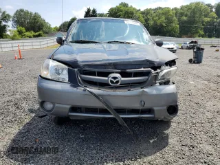 2002 Mazda Tribute LX with VIN 4F2CU09182KM28600, listed as a Copart auction lot 62314004 with 108,048 mi miles and Salvage Title. Bid and sale history available at carsss.com. Image 5.