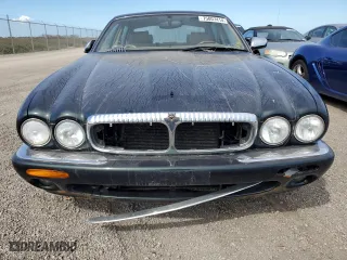 1999 Jaguar XJ with VIN SAJKX6047XC861227, listed as a Copart auction lot 75007414 with 0 mi miles and Salvage Title. Bid and sale history available at carsss.com. Image 5.
