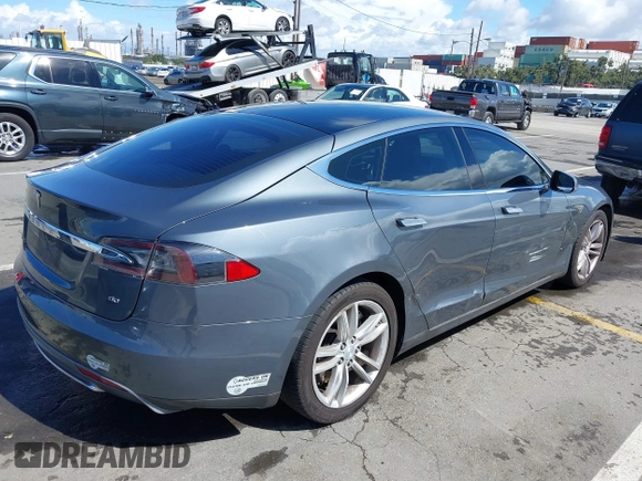 2014 Tesla Model S 60 with VIN 5YJSA1S15EFP29010, listed as a IAAI auction lot 41798180 with 142,754 mi miles and . Bid and sale history available at DreamBid. Image 4.
