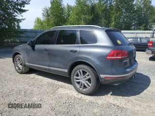 2015 Volkswagen Touareg Lux z VIN WVGEP9BP0FD006992, wystawiony jako Copart lot #59524445 z przebiegiem 169 822 mil mil oraz Szkoda całkowita • Salvage title. Historia ofert i sprzedaży dostępna na DreamBid. Obrazek 2.
