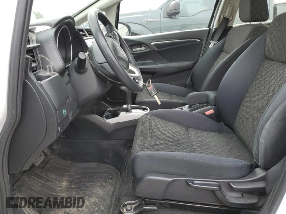 2016 Honda Fit LX with VIN JHMGK5H59GX004764, listed as a Copart auction lot 65131715 with 75,726 mi miles and Salvage title. Bid and sale history available at DreamBid. Image 7.