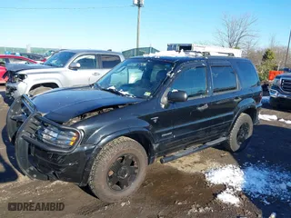 2002 Ford Escape Limited with VIN 1FMCU041X2KC74197, listed as a IAAI auction lot 41363369 with 153,704 mi miles. Bid and sale history available at carsss.com. Image 17.