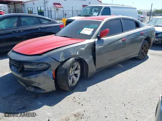 2016 Dodge Charger SXT with VIN 2C3CDXHG9GH214362, listed as a IAAI auction lot 42028636 with 225,392 mi miles. Bid and sale history available at carsss.com. Image 2.