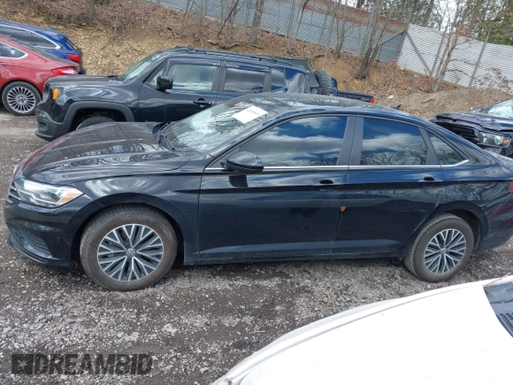 2021 Volkswagen Jetta S z VIN 3VWC57BU0MM035340, wystawiony jako IAAI lot #42045819 z przebiegiem 76 751 mil mil oraz . Historia ofert i sprzedaży dostępna na DreamBid. Obrazek 14.
