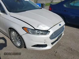 2016 Ford Fusion Titanium Hybrid with VIN 3FA6P0RU2GR357739, listed as a IAAI auction lot 42120441 with 151,201 mi miles. Bid and sale history available at carsss.com. Image 6.