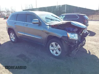 2012 Jeep Grand Cherokee Laredo with VIN 1C4RJFAG0CC145061, listed as a IAAI auction lot 41820140 with 185,015 mi miles. Bid and sale history available at carsss.com. Image 1.