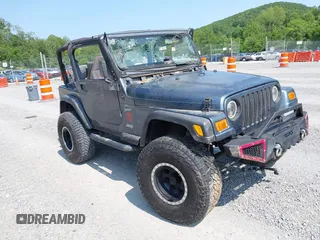 2001 Jeep Wrangler Sport z VIN 1J4FA49S11P322636, wystawiony jako IAAI lot #42409917 z przebiegiem 88 675 mil mil oraz . Historia ofert i sprzedaży dostępna na DreamBid. Obrazek 1.