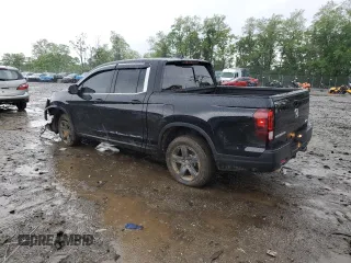 2023 Honda Ridgeline RTL with VIN 5FPYK3F51PB067811, listed as a Copart auction lot 56795995 with 21,500 mi miles and Salvage title. Bid and sale history available at DreamBid. Image 2.