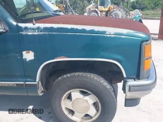 1995 GMC Suburban z VIN 1GKFK16K9SJ728534, wystawiony jako IAAI lot #42358029 z przebiegiem 279 148 mil mil oraz . Historia ofert i sprzedaży dostępna na DreamBid. Obrazek 14.