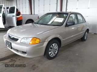 2000 Mazda Protege DX with VIN JM1BJ2221Y0239987, listed as a IAAI auction lot 42092488 with 140,756 mi miles and . Bid and sale history available at DreamBid. Image 2.