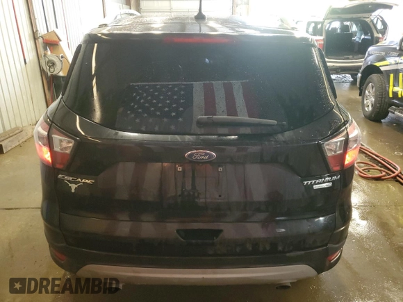 2018 Ford Escape Titanium with VIN 1FMCU9J9XJUA01357, listed as a Copart auction lot 56868735 with 67,315 mi miles and Salvage title. Bid and sale history available at DreamBid. Image 6.