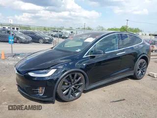 2019 Tesla Model X 75D with VIN 5YJXCBE21KF180203, listed as a IAAI auction lot 42190255 with 114,294 mi miles and . Bid and sale history available at carsss.com. Image 2.