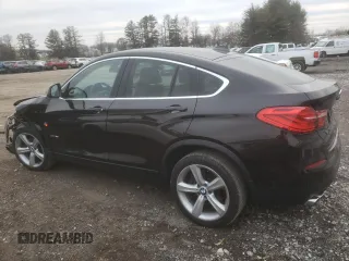2015 BMW X4 xDrive28i with VIN 5UXXW3C55F0M88228, listed as a Copart auction lot 82940173 with 73,519 mi miles. Bid and sale history available at carsss.com. Image 2.
