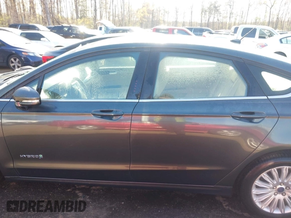 2015 Ford Fusion SE Hybrid with VIN 3FA6P0LU2FR135144, listed as a IAAI auction lot 41975973 with 89,315 mi miles. Bid and sale history available at carsss.com. Image 14.
