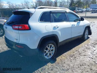 2015 Jeep Cherokee Latitude with VIN 1C4PJMCSXFW588673, listed as a IAAI auction lot 41666268 with 104,737 mi miles. Bid and sale history available at carsss.com. Image 4.