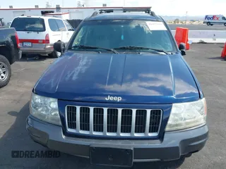 2004 Jeep Grand Cherokee with VIN 1J4GX48J74C283123, listed as a IAAI auction lot 42477393 with 182,491 mi miles and . Bid and sale history available at DreamBid. Image 13.