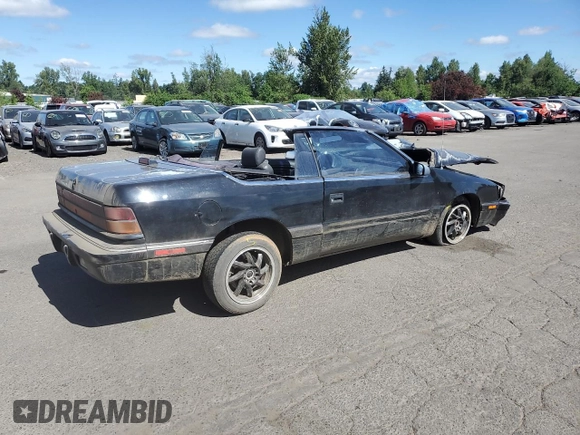 1992 Chrysler LeBaron z VIN 1C3XU4537NF129794, wystawiony jako Copart lot #71594804 z przebiegiem 156 624 mil mil oraz Szkody całkowita. Historia ofert i sprzedaży dostępna na DreamBid. Obrazek 3.