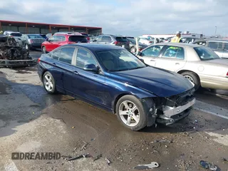 2013 BMW 3 Series 320i with VIN WBA3B1C58DK129051, listed as a IAAI auction lot 41119380 with 101,427 mi miles. Bid and sale history available at carsss.com. Image 1.