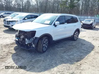 2020 Kia Telluride S with VIN 5XYP64HC2LG005623, listed as a IAAI auction lot 41492269 with 137,147 mi miles and . Bid and sale history available at DreamBid. Image 2.