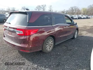 2018 Honda Odyssey EX-L with VIN 5FNRL6H73JB028770, listed as a IAAI auction lot 41984094 with 96,819 mi miles and . Bid and sale history available at DreamBid. Image 4.