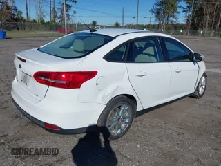 2017 Ford Focus SE with VIN 1FADP3F2XHL274975, listed as a IAAI auction lot 38283193 with 77,832 mi miles and . Bid and sale history available at DreamBid. Image 4.