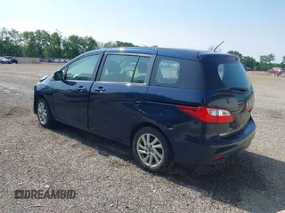2015 Mazda 5 Sport z VIN JM1CW2BL9F0187973, wystawiony jako IAAI lot #42378711 z przebiegiem 97 543 mil mil oraz . Historia ofert i sprzedaży dostępna na DreamBid. Obrazek 3.