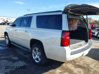 2015 Chevrolet Suburban LT with VIN 1GNSKJKC9FR717038, listed as a IAAI auction lot 41815942 with 123,095 mi miles and . Bid and sale history available at DreamBid. Image 3.