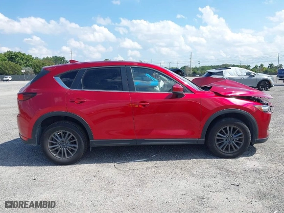 2021 Mazda CX-5 Touring with VIN JM3KFACMXM0462381, listed as a IAAI auction lot 40993844 with 53,528 mi miles. Bid and sale history available at carsss.com. Image 12.