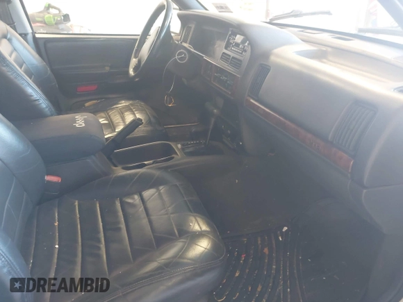 1997 Jeep Grand Cherokee Laredo with VIN 1J4GZ58SXVC552435, listed as a IAAI auction lot 41977888 with 143,832 mi miles. Bid and sale history available at carsss.com. Image 5.