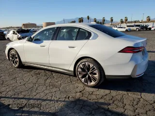 2024 BMW 5 Series 530i with VIN WBA43FJ0XRCS05943, listed as a Copart auction lot 87277084 with 4,924 mi miles and Salvage Title. Bid and sale history available at carsss.com. Image 2.