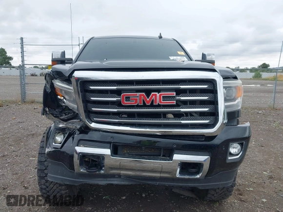 2015 GMC Sierra 2500HD SLT with VIN 1GT12ZE87FF552599, listed as a IAAI auction lot 40054977 with 146,190 mi miles and . Bid and sale history available at DreamBid. Image 6.